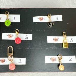 Louis Vuitton zipper pull charms ONE